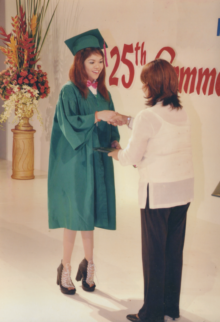 A young woman born with clubfoot graduates from high school.